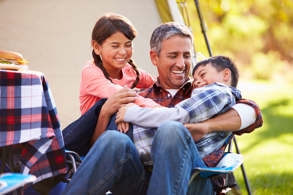 Father with Children Enjoying Camping